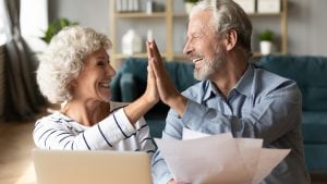 Gold IRA Investing Company a happy senior couple 300x169
